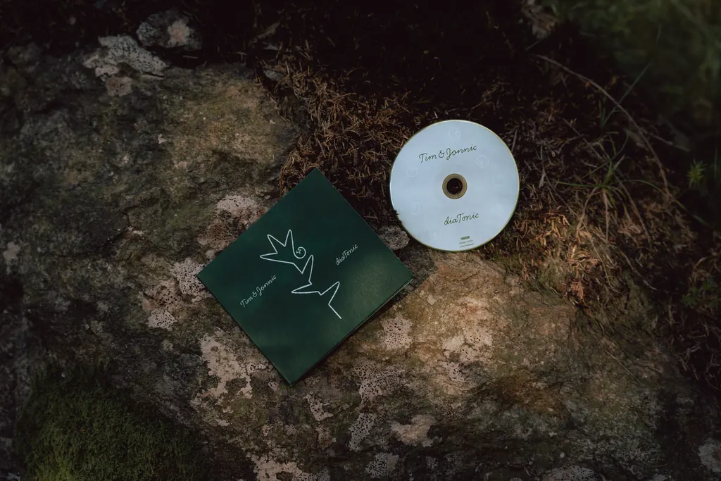 The diaTonic CD and sleeve lying on a mossy rock